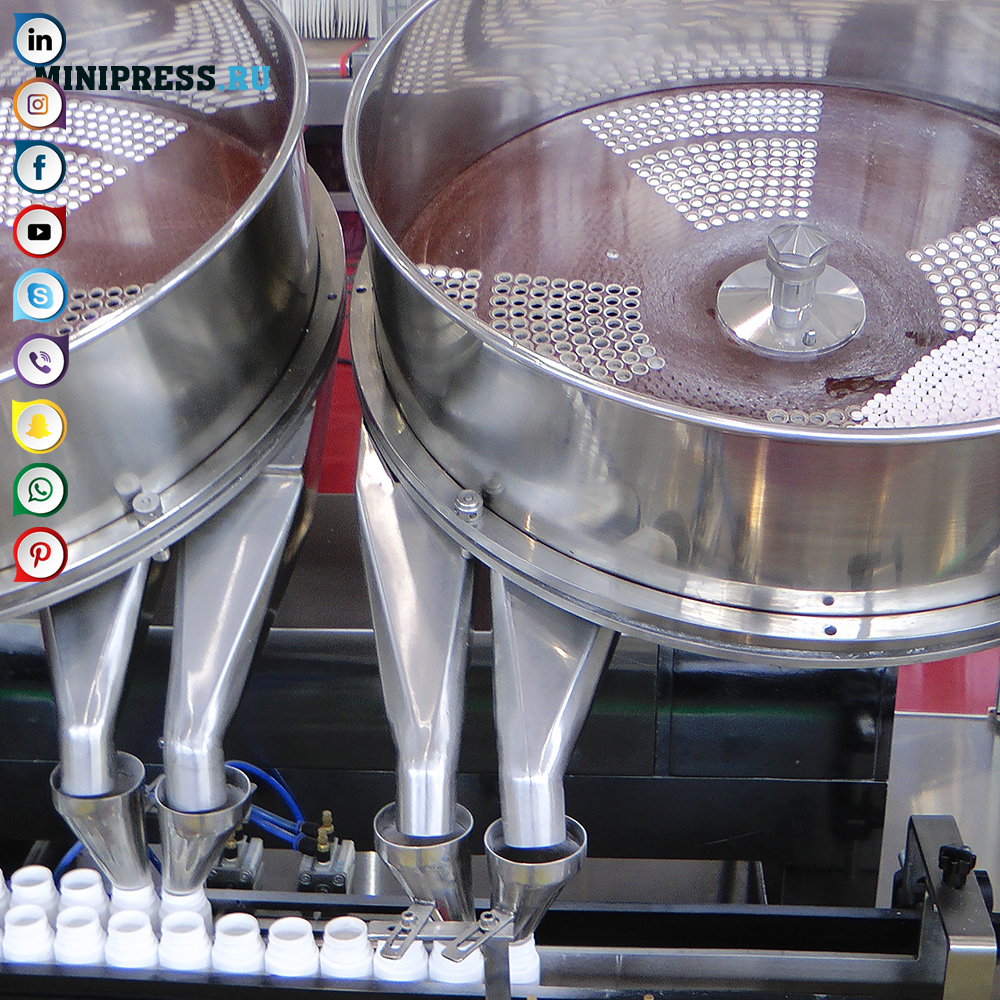 Maschine mit zwei rotierenden Scheiben zum Zählen und Abfüllen von Tabletten und Gelatinekapseln