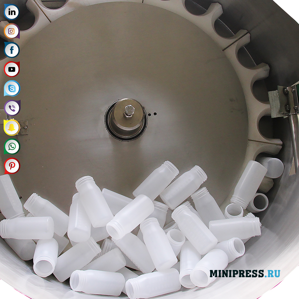 Tagħmir awtomatiku biex jorjenta fliexken tal-plastik